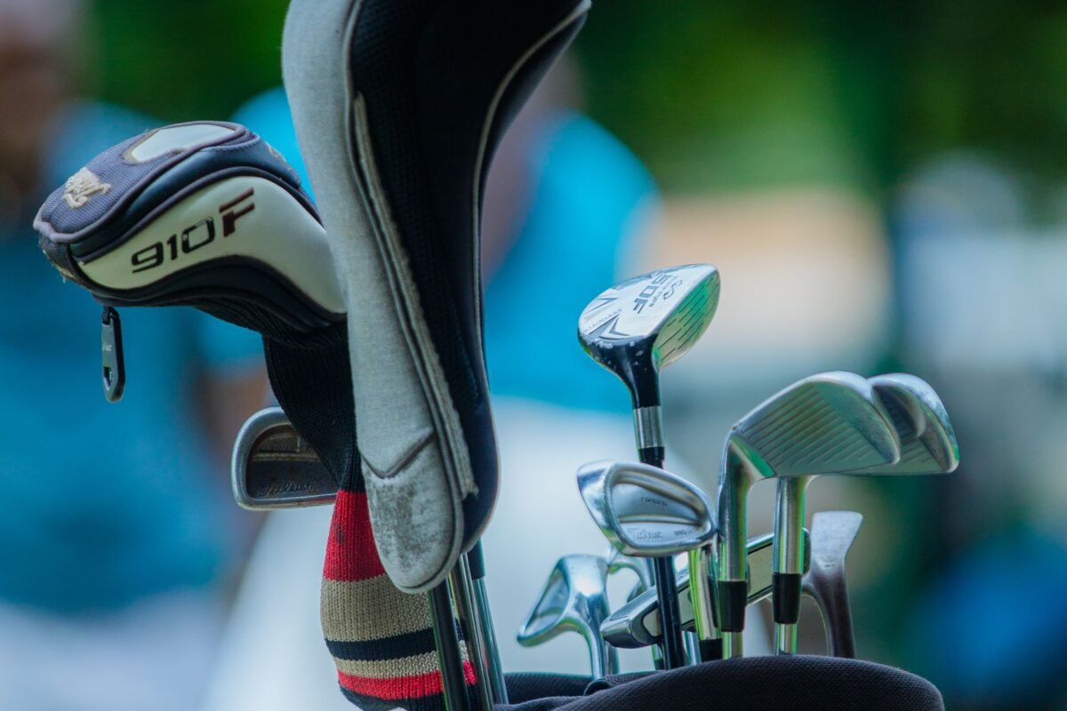 A full set of clubs in a bag on a sunny day