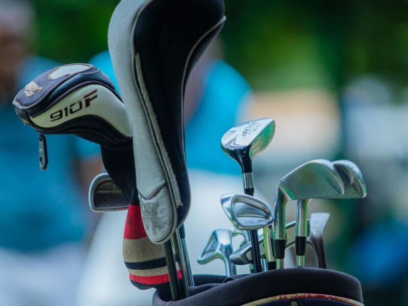 A full set of clubs in a bag on a sunny day