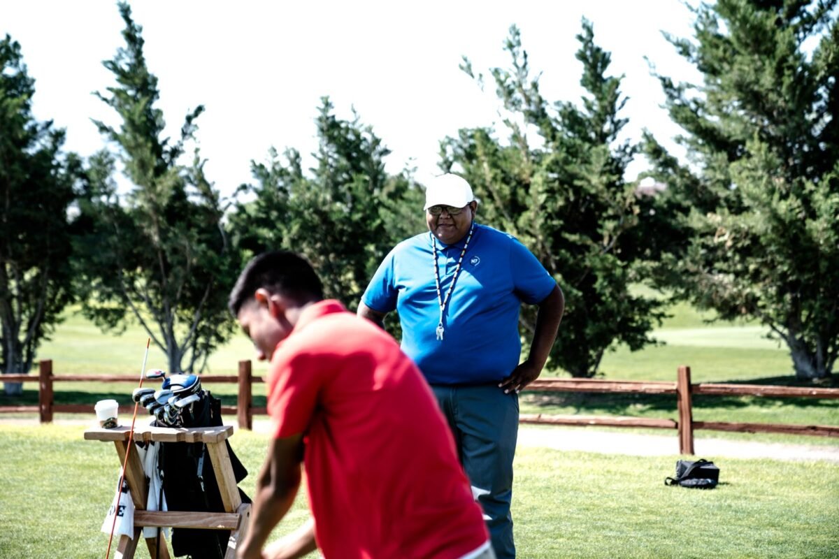 Two colleagues talking on the course