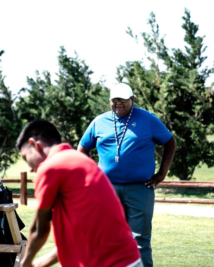 Two colleagues talking on the course