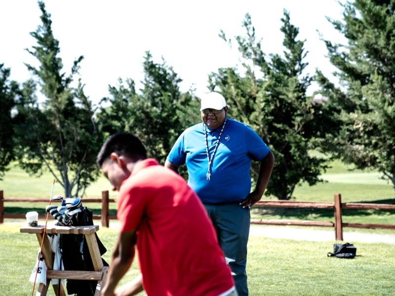 Two colleagues talking on the course