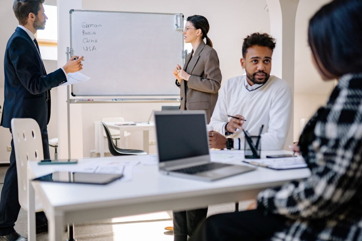 A committee in discussion around a meeting table