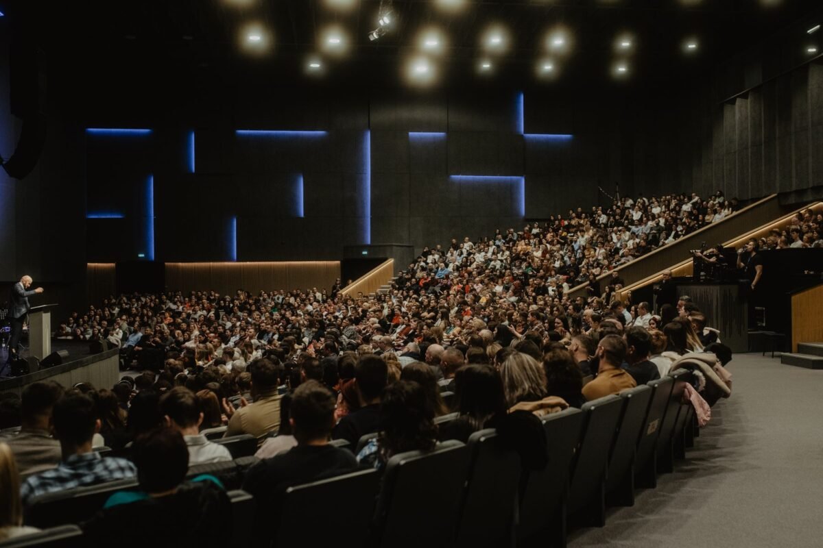 Guests gathered at an evening presentation after an event
