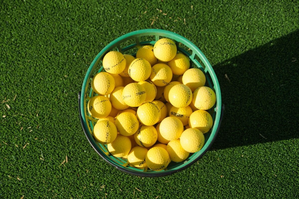 A basket of practice balls at an indoor range bay