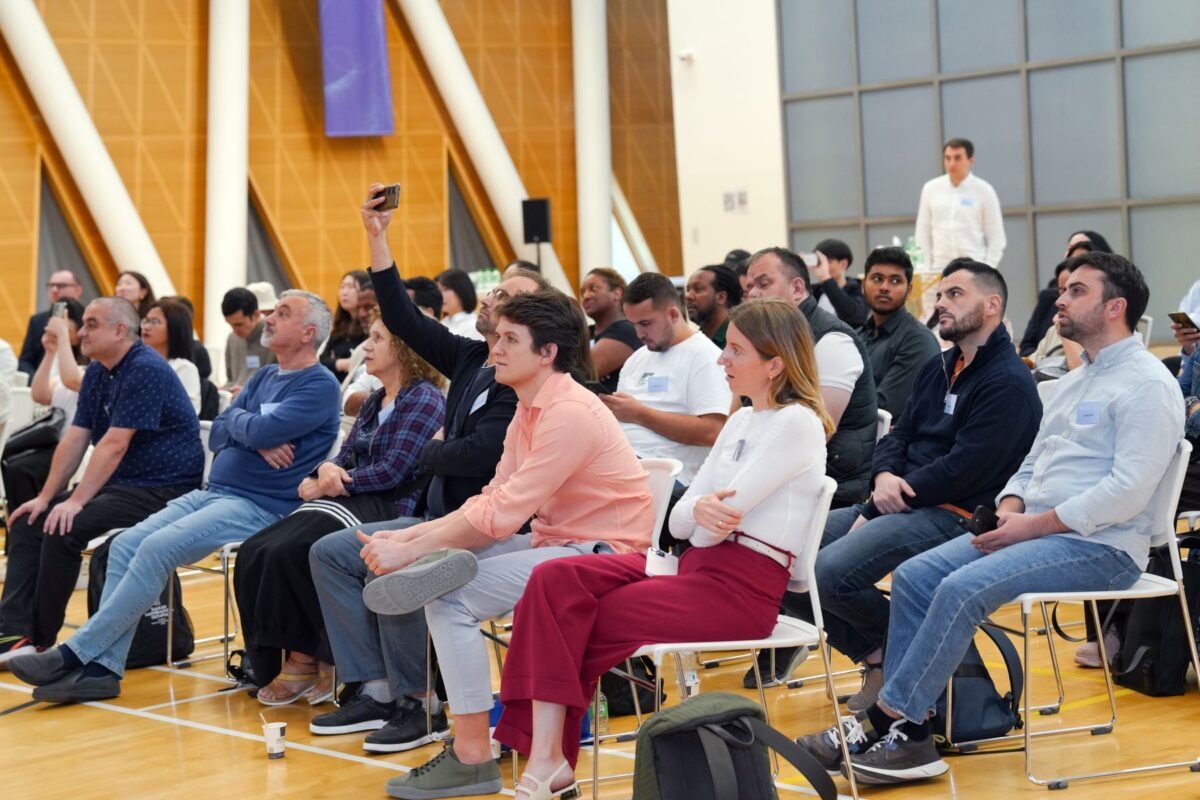 An audience seated at an indoor seminar