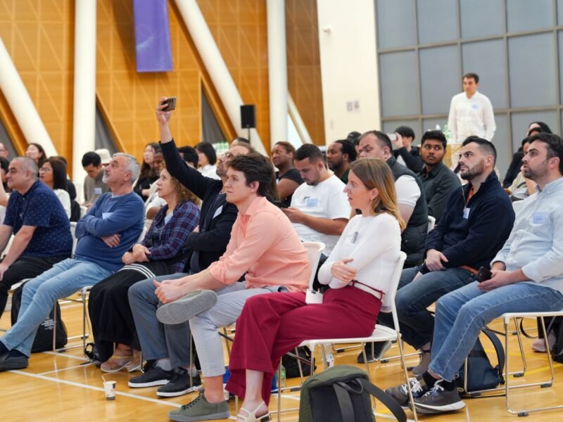 An audience seated at an indoor seminar