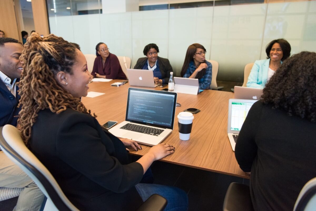 A marketing team working together on laptops