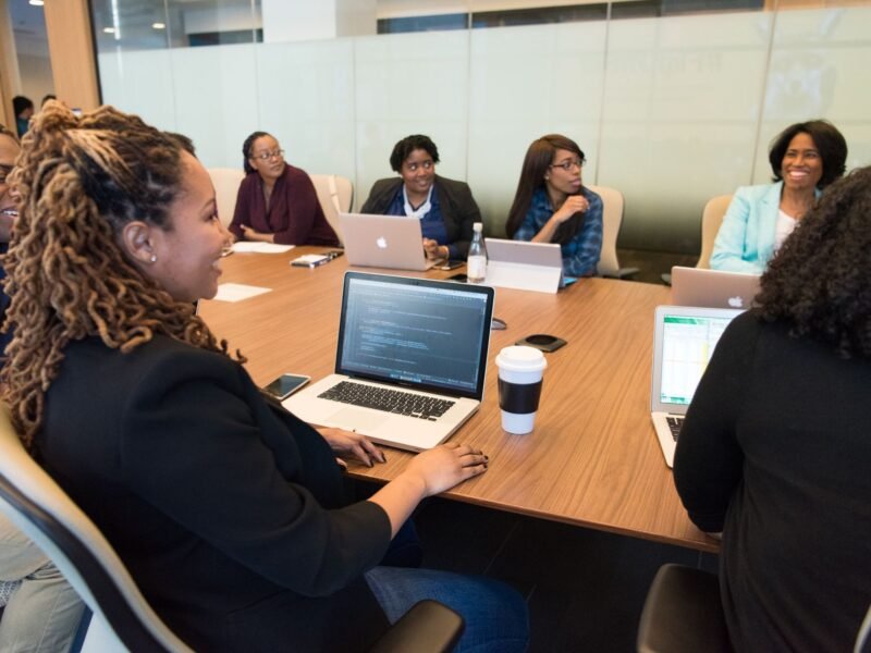 A marketing team working together on laptops